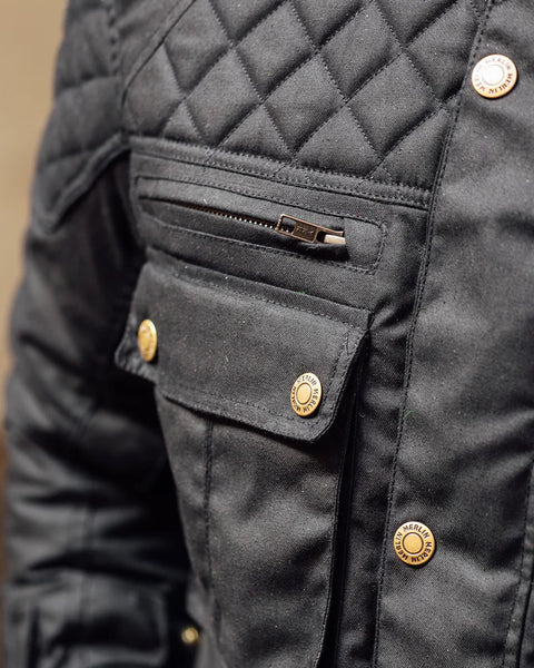 Merlin Edale II Waxed D3O Jacket - Black worn by model outdoors showing detail