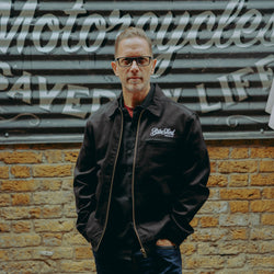 model wearing the black twill motorcycle jacket