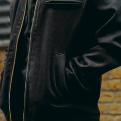 model wearing the black twill motorcycle jacket - pocket detail