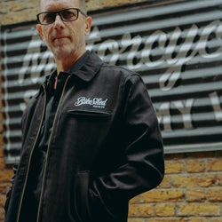 model wearing the black twill motorcycle jacket