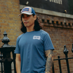 Model wearing Navy blue t-shirt with 'Moto Bikeshed co'  logo