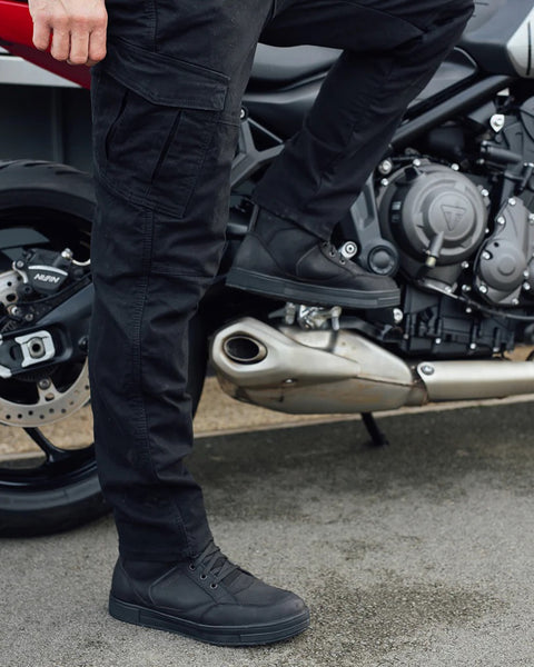 Merlin Remy 2 Riding Cargo Pants - Black worn by model outdoors with motorcycle