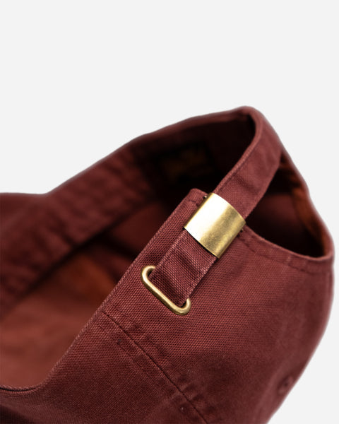 Red cap studio shot with 'Bike Shop Moto Company' logo on a white background