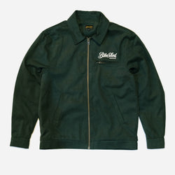Green Motorcycle jacket with a Bike Shed Moto Co brand logo on a white background