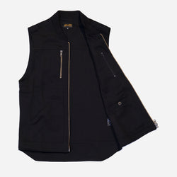 Black motorcycle vest with zippers on a white background