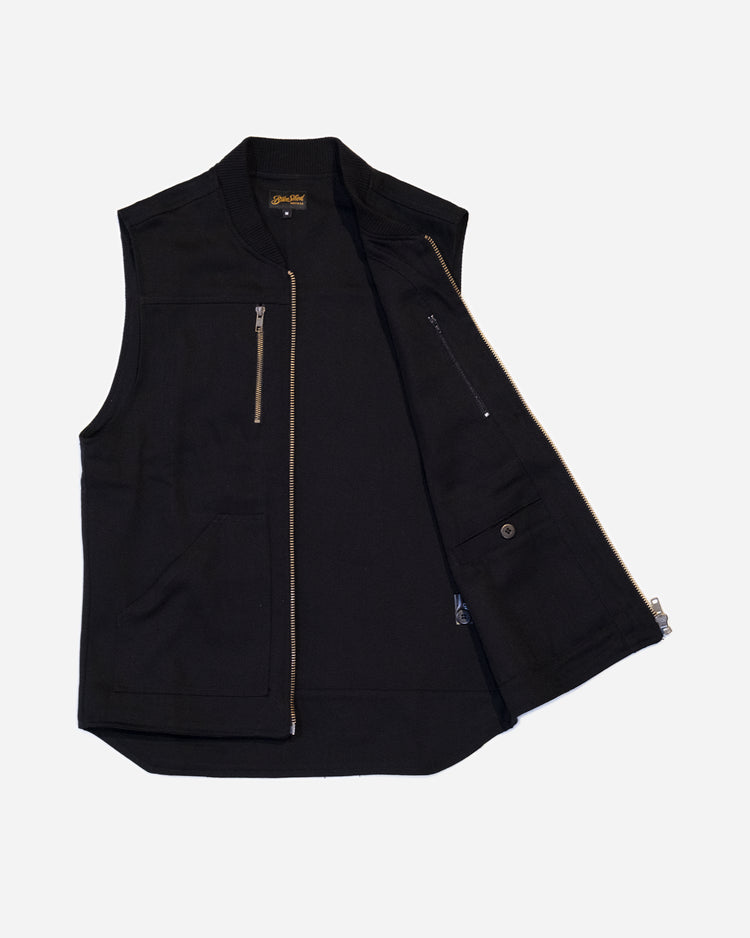 Black motorcycle vest with zippers on a white background