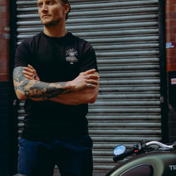model wearing black motorcycle graphic t-shirt