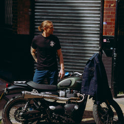 Model wearing black motorcycle graphic t-shirt